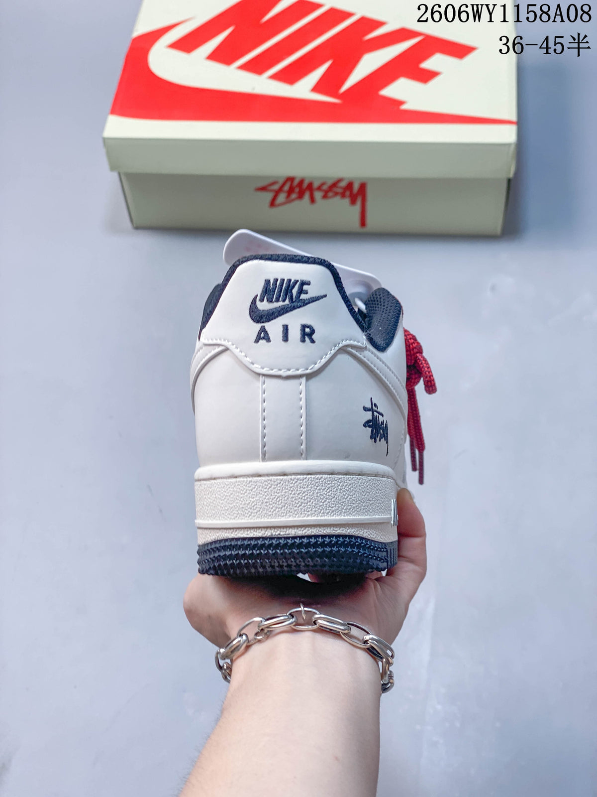 Rear view of the sneaker showing Nike Air branding and a dark navy outsole.
