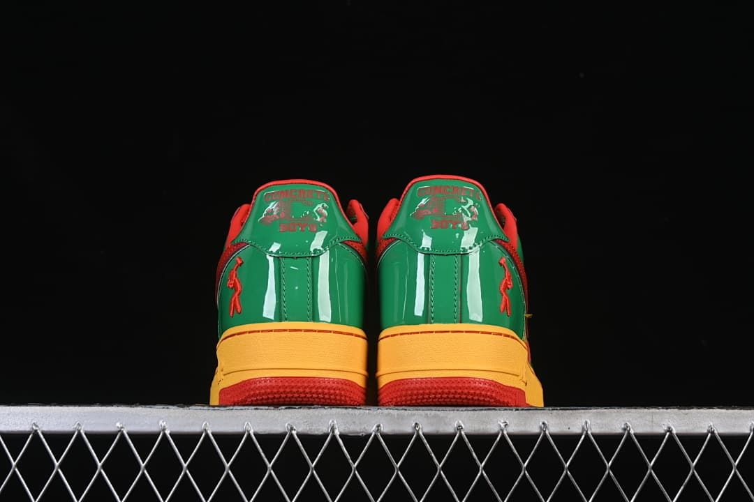 Rear view of both shoes with green heel panels and decorative details