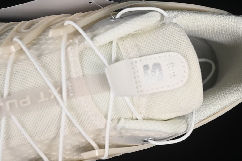 Top-down close-up of the tongue, laces and textile upper.