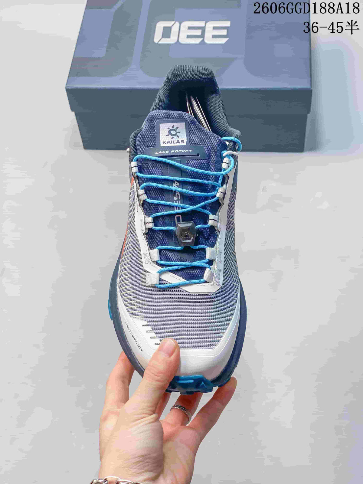 Top view of the shoe tongue, lace pocket, and blue quick-lacing system