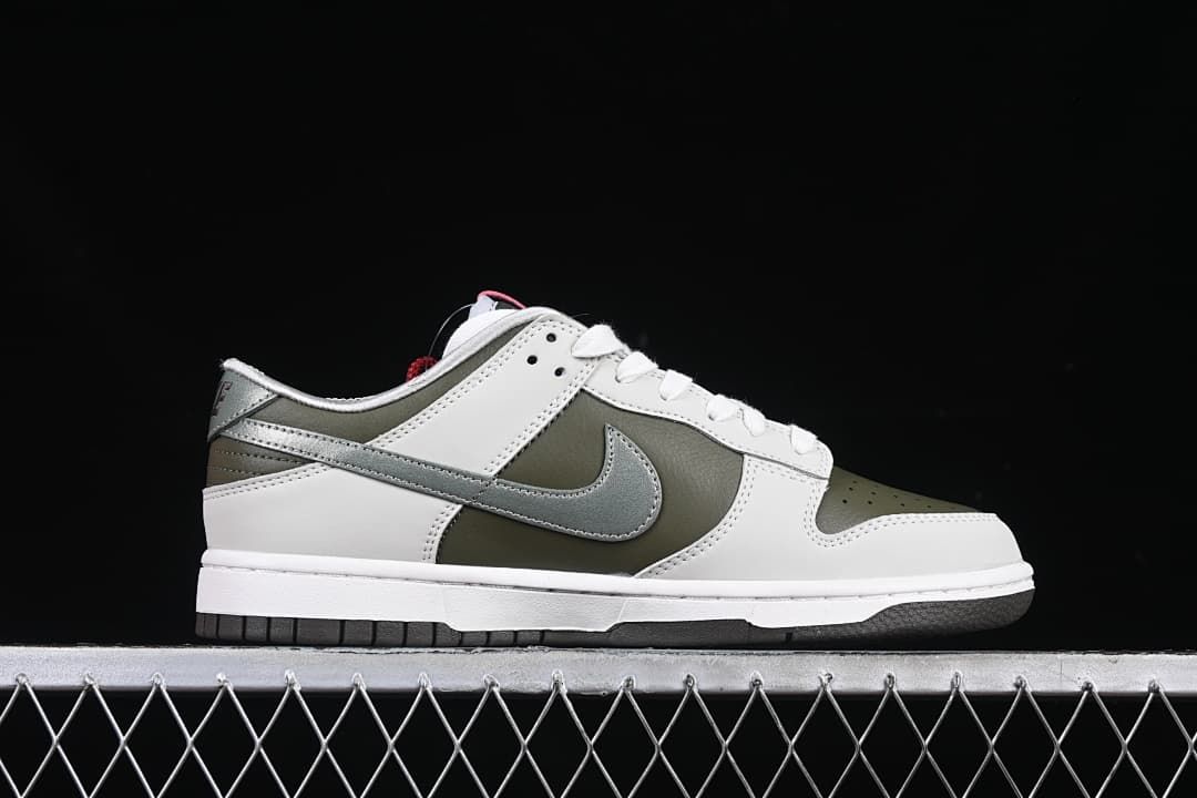 Side profile of the low-top sneaker with white, olive, and metallic silver panels.