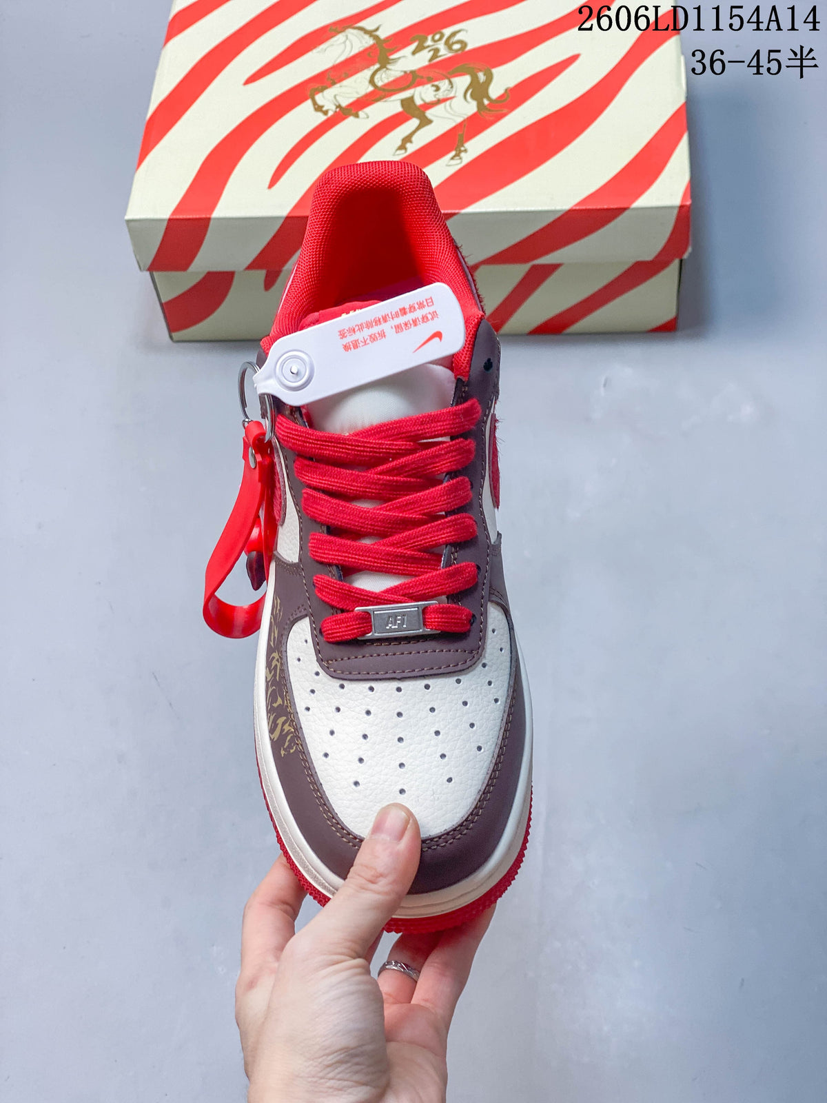 Top view showing red laces, a perforated white toe, and brown overlays.