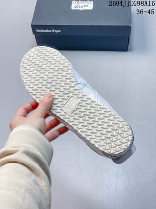 Underside view of the sneaker showing the repeating textured outsole pattern.
