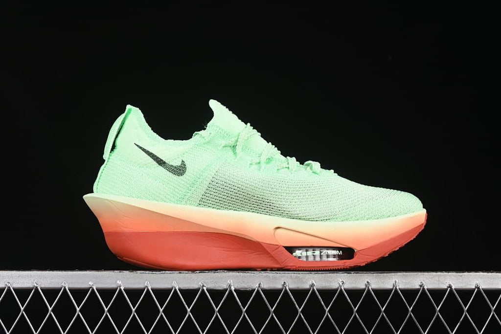 Side profile showing the mint-green upper and coral-toned sole