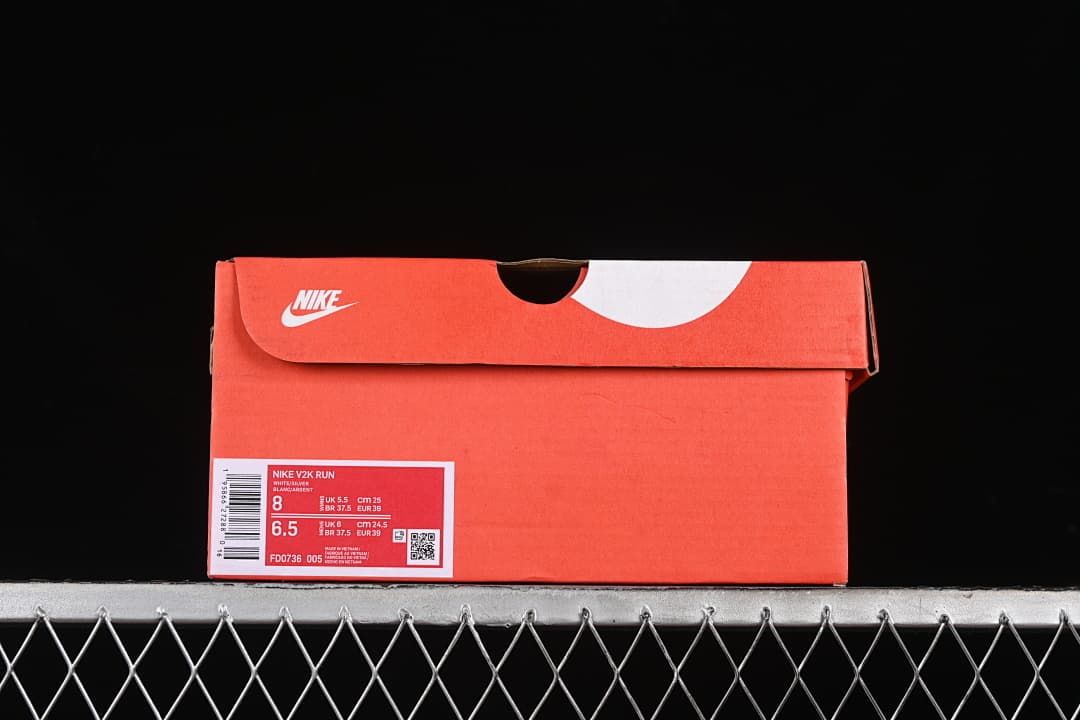 Nike shoe box label showing V2K Run, style code FD0736-005, and sample size EU 39