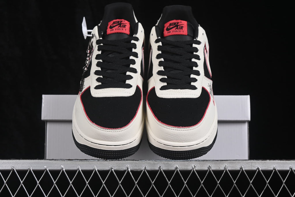Front view of the pair with black toe boxes, white overlays, black laces and red tongue labels.