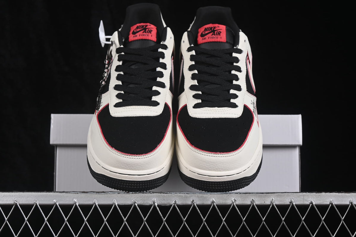 Front view of the pair with black toe boxes, white overlays, black laces and red tongue labels.