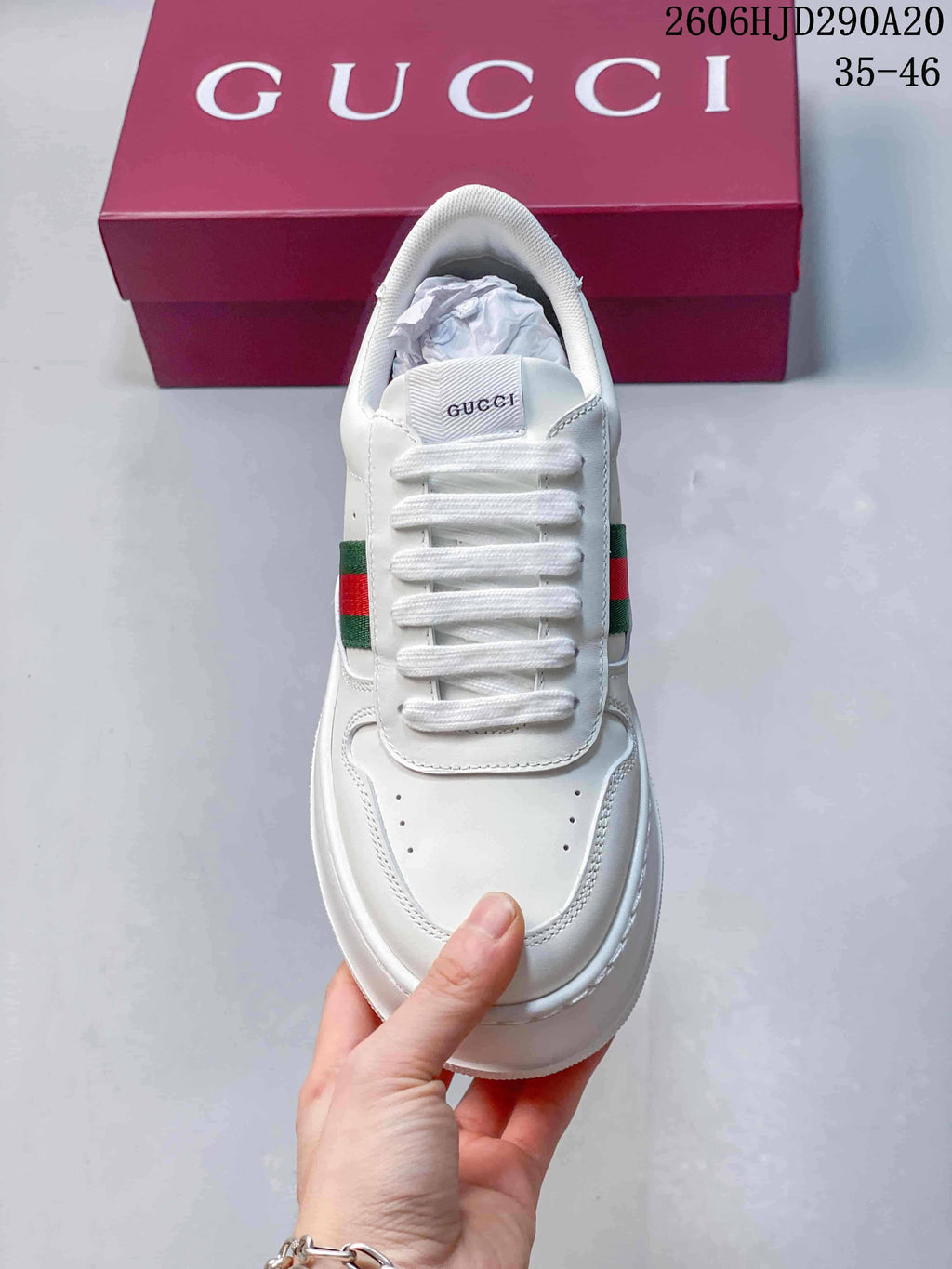 Top view of the white lace-up sneaker with perforated toe and side details