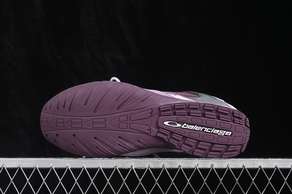Close view of the purple textured outsole with molded tread and Balenciaga branding.