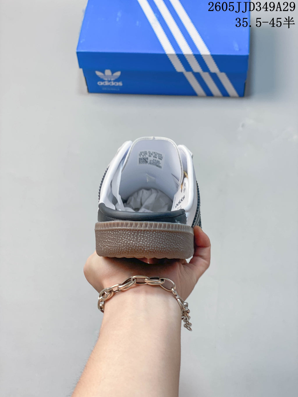 Rear view of the open-heel mule sneaker.