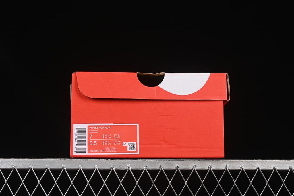 Shoe box label showing Nike V2K Run, style code HQ4046-100, and sample size markings