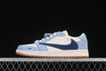 Side view of a light blue, navy, and off-white low-top sneaker with patterned panels and a gum-colored outsole