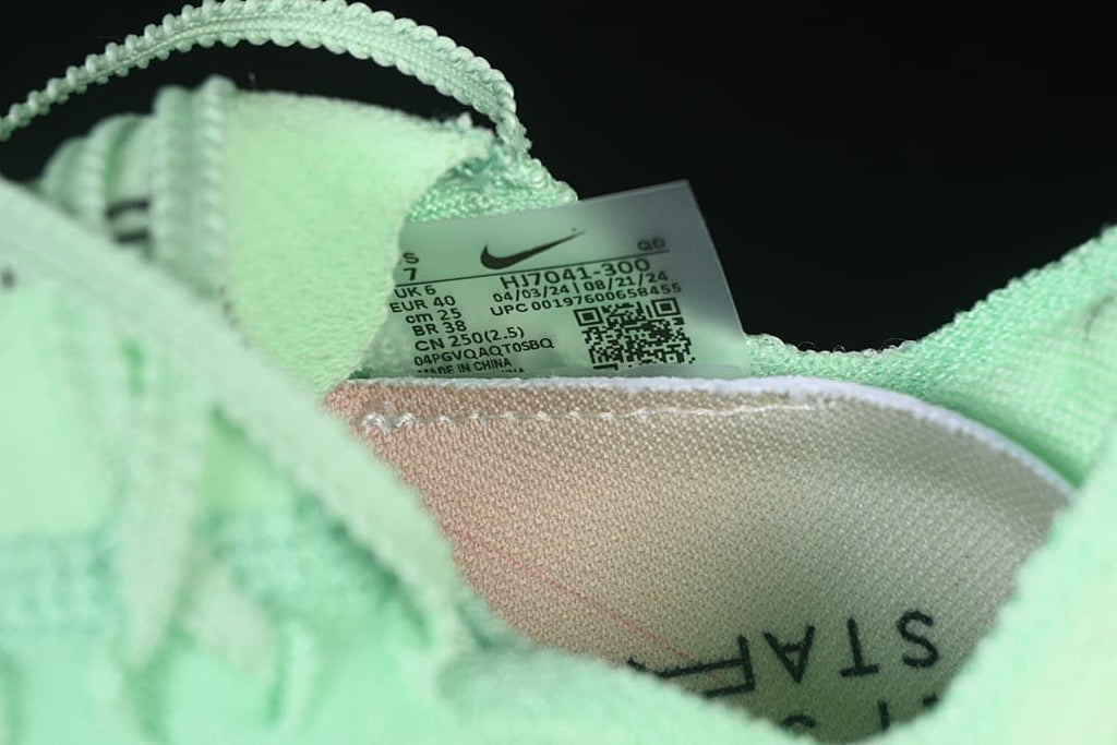 Close-up of the shoe size label showing EU 40 and style code HJ7041-300.