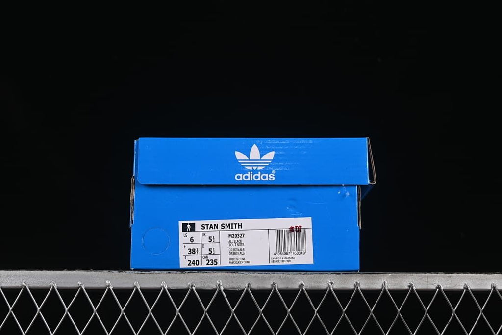 Blue Adidas shoe box with a Stan Smith label showing sample size details