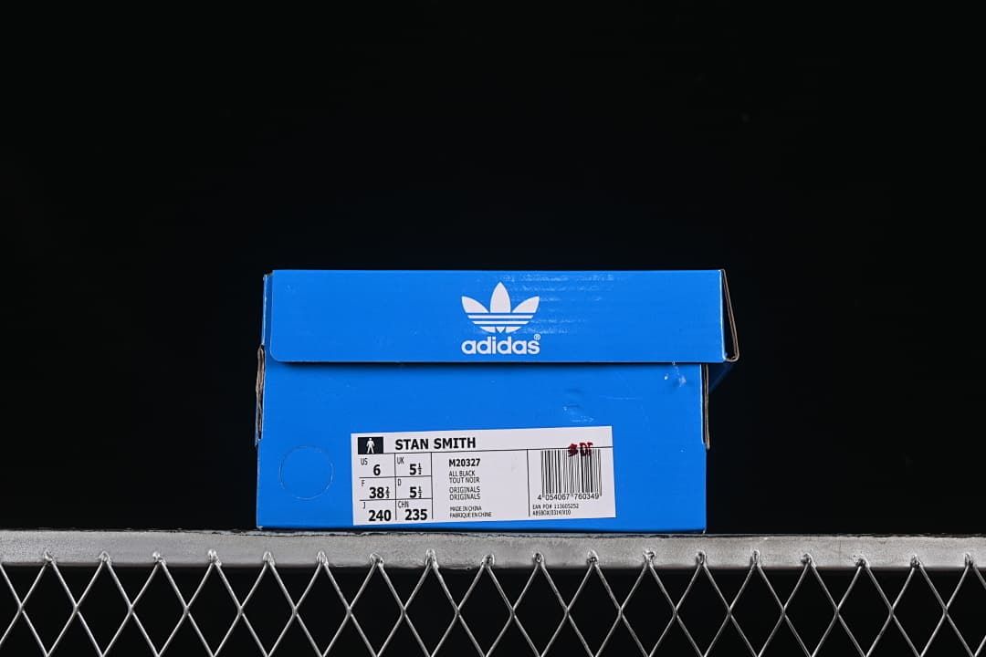 Blue Adidas shoe box with a Stan Smith label showing sample size details