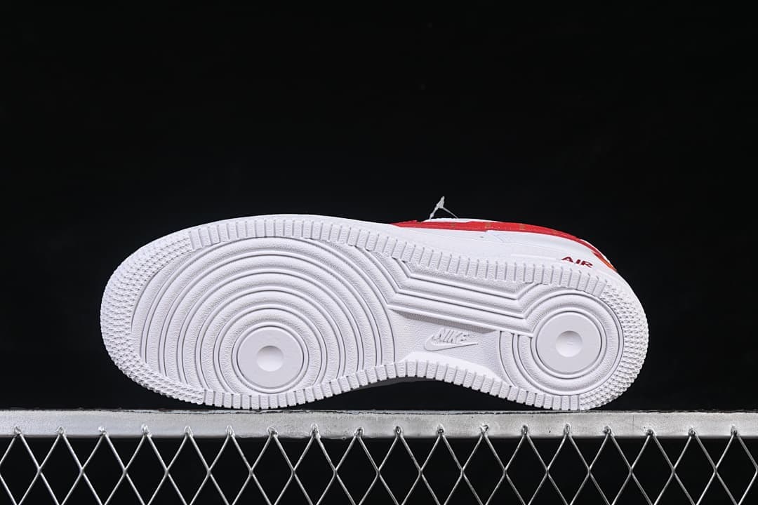 Underside of the white Air Force 1 outsole with circular tread patterns.