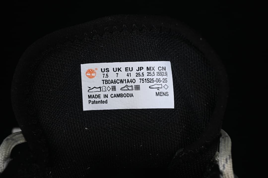 Tongue label showing size conversions, style code TB0A6CW1A40, and men's sizing.