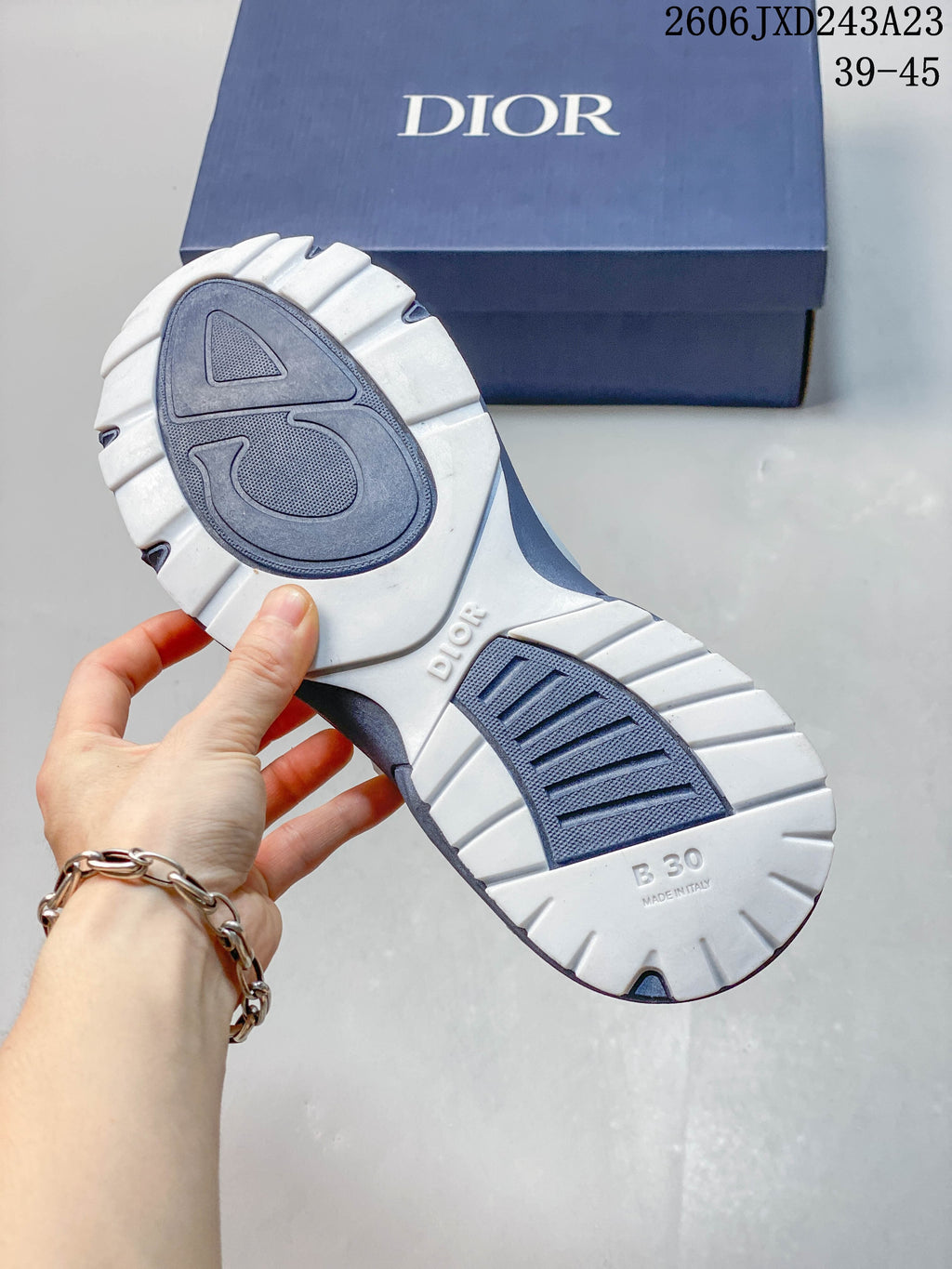 Close-up of the sneaker outsole with patterned tread and B30 marking