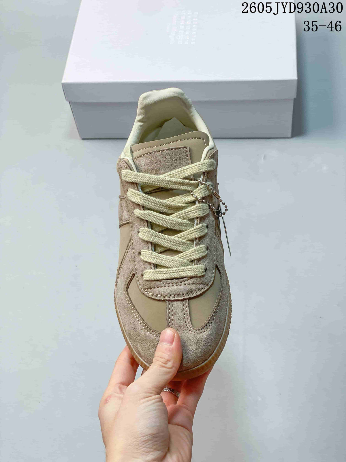 Front view of the sneaker showing its lacing and contrasting toe panels.