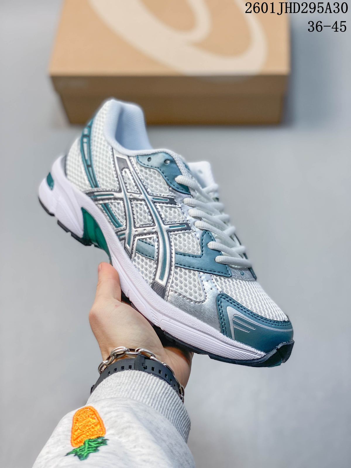 Close side view of the ASICS logo and layered upper