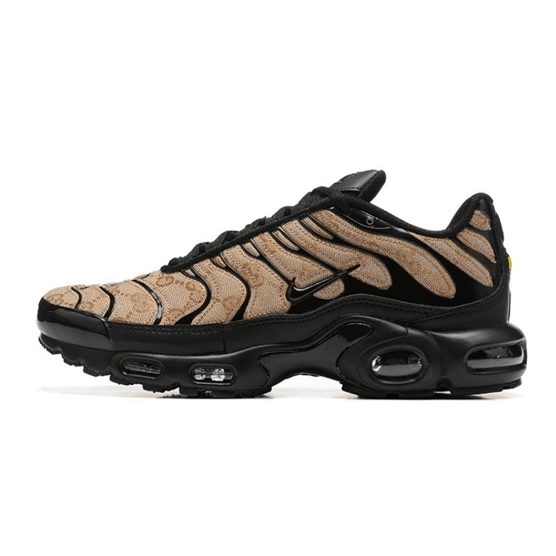 Tan patterned Nike Air Max Plus sneaker with black overlays and sole.