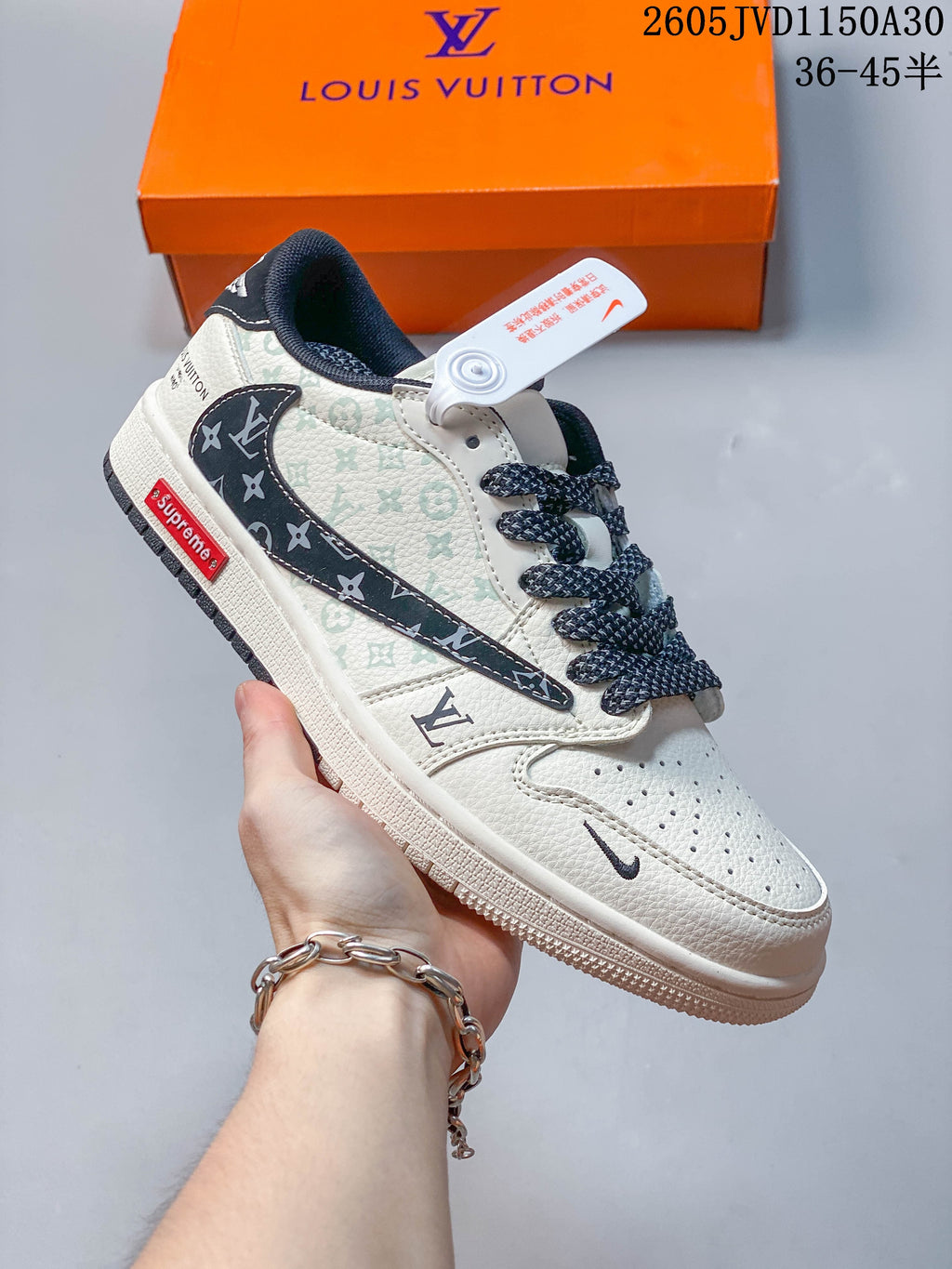 Angled close-up of the sneaker showing the patterned side panels, dark side detail, and red side label.