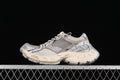 Side view of a beige and grey Balenciaga Stapler sneaker