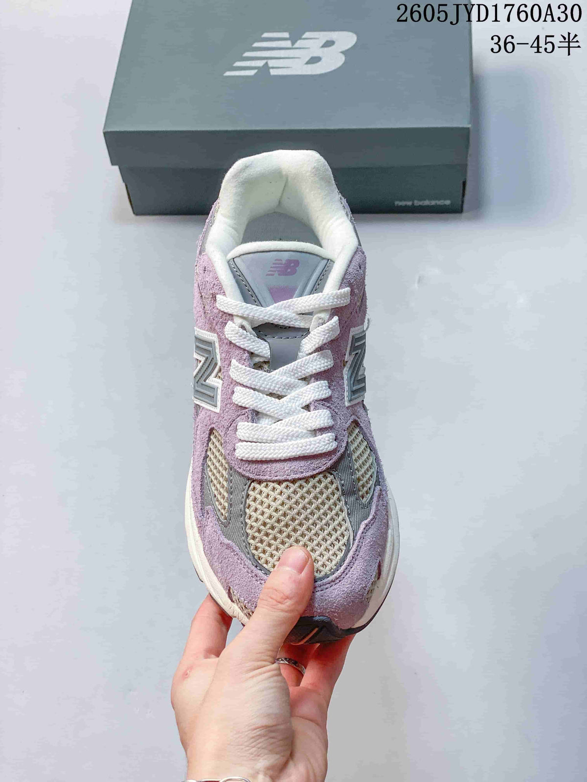 Top view of a New Balance 2010 sneaker with mesh panels and white laces.