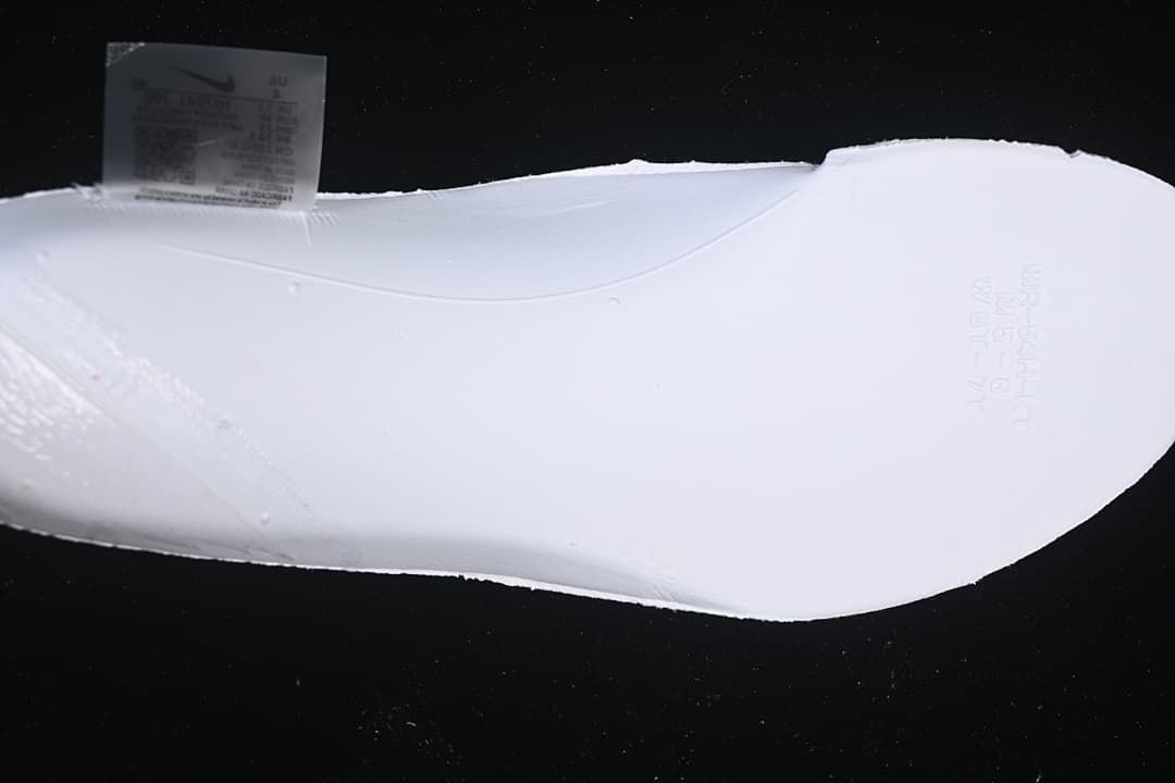 Close-up of the white shoe sole and interior size label