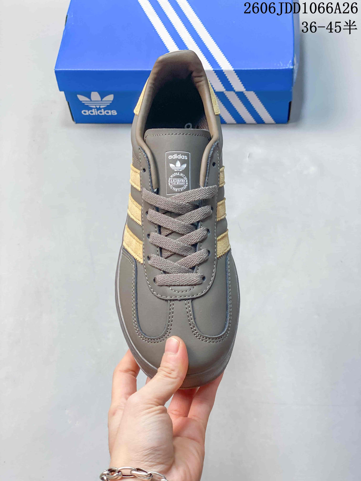 Top view showing the laces, tongue, and gold-tone side stripes