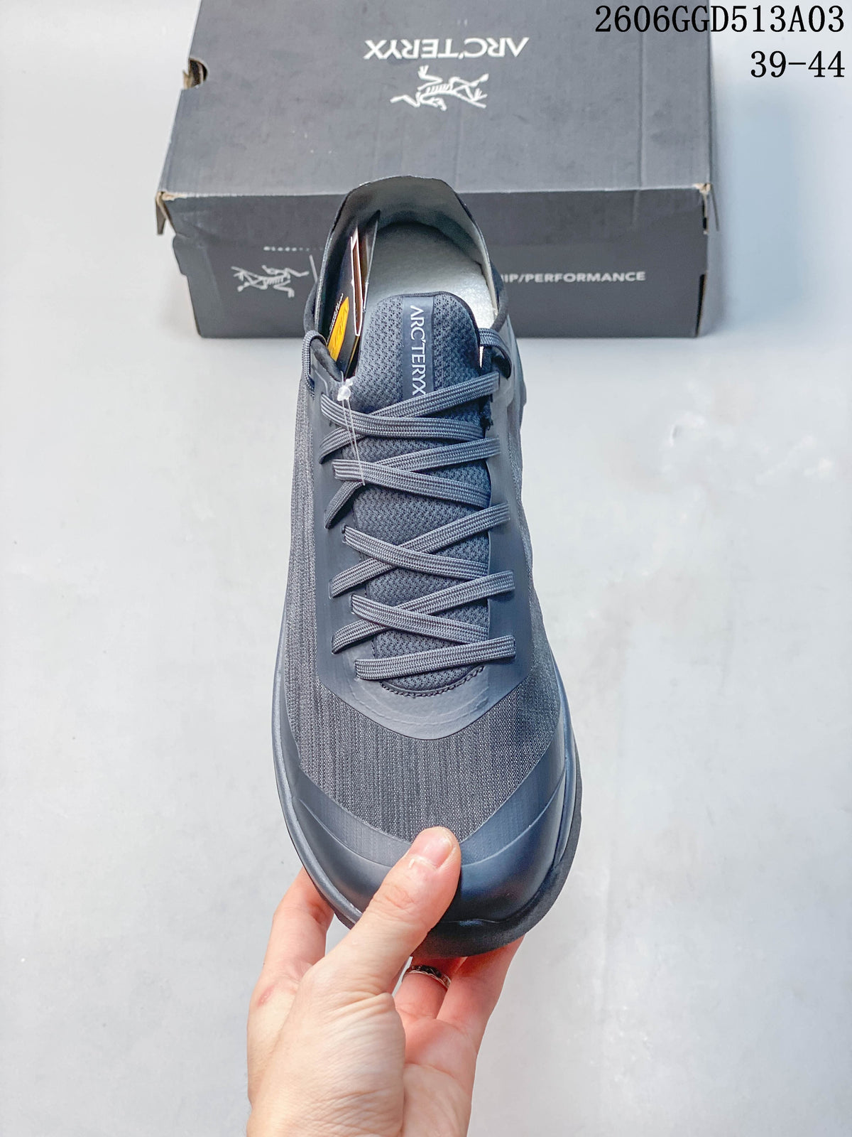 Top view showing the tongue and lace pattern of the gray-blue shoe.