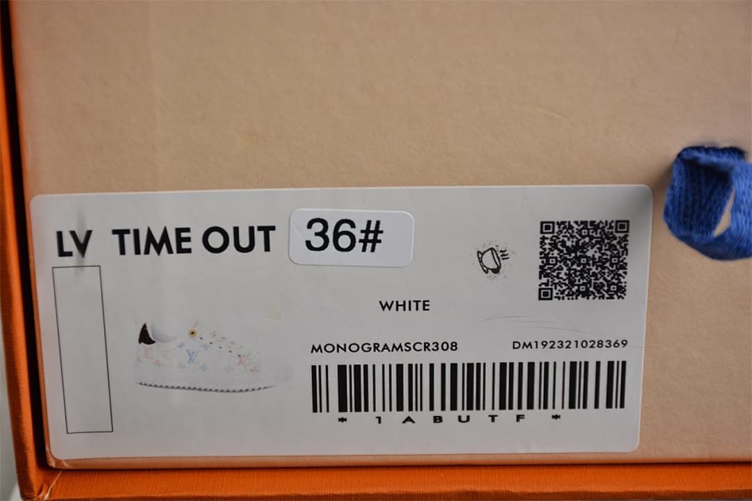 Box label identifying the shoe as LV Time Out, size 36, white