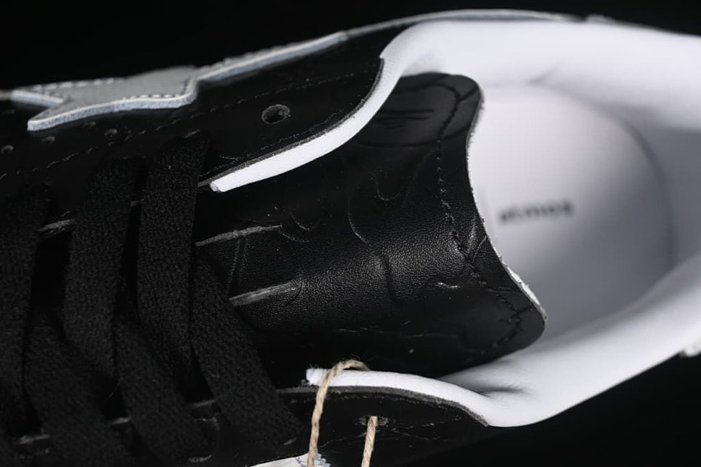 Close-up of the tongue, laces, and white collar lining