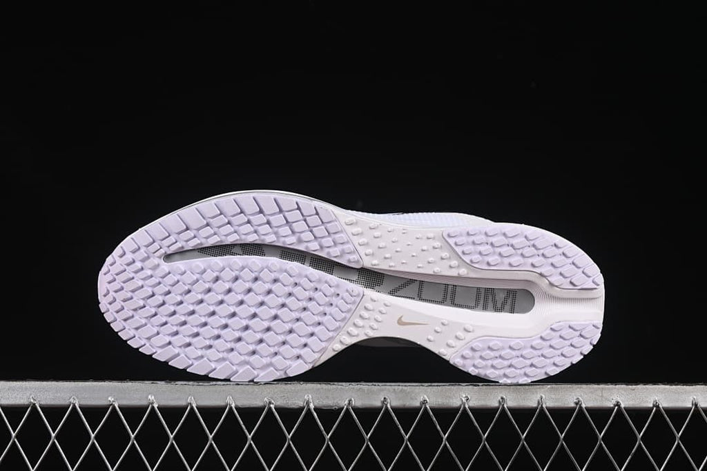 Outsole view showing the tread pattern and central sole details.