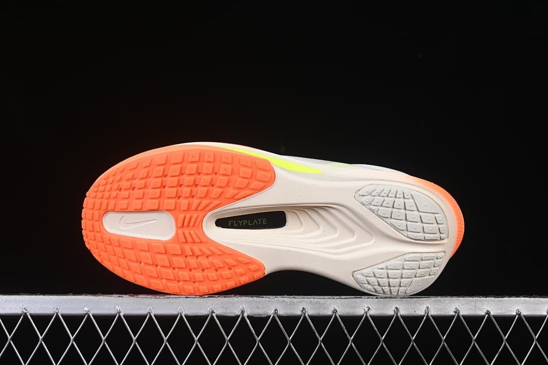 Underside view showing the patterned orange and gray outsole.