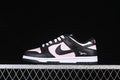 Side view of a black and pale pink low-top sneaker with a Swoosh and small Berry heel graphic.