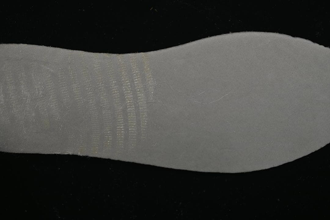 Close-up of the grey textured sneaker outsole