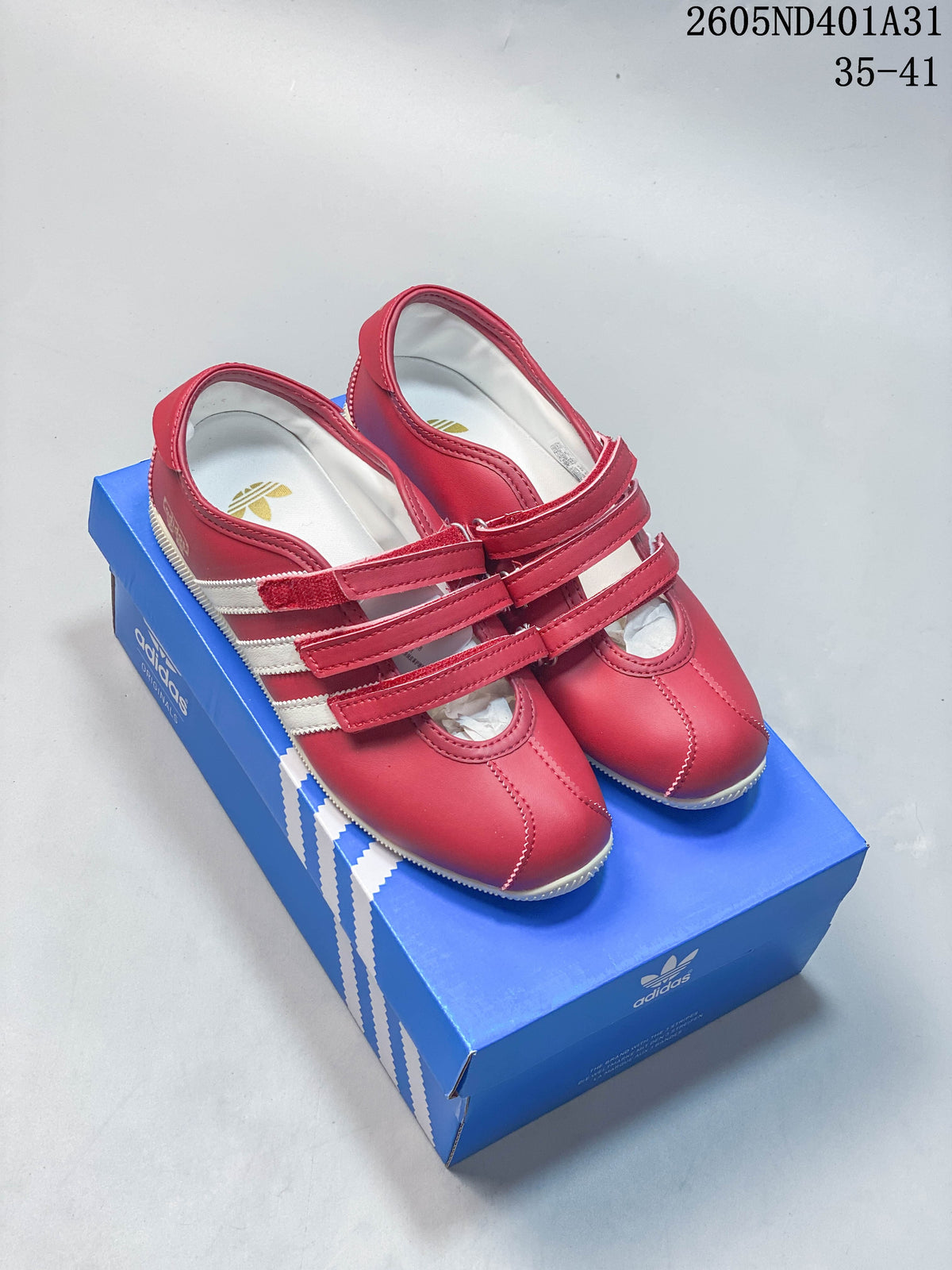 Red Adidas Samba Vegan OG-style low-top sneakers with white stripes and multiple straps
