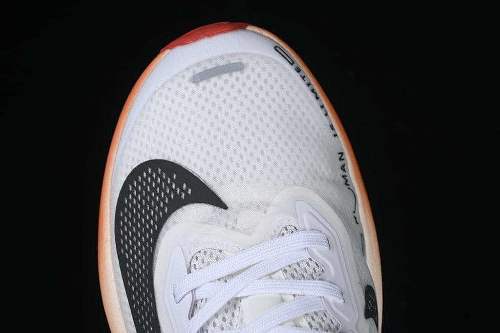 Top-down close-up of the perforated-look toe and black swoosh