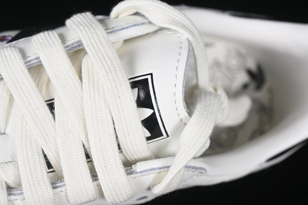 Close-up of white laces and tongue branding