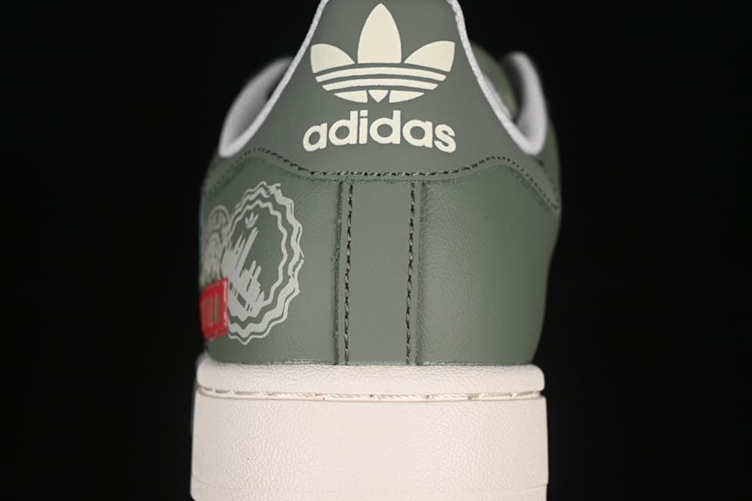 Rear view of the green sneaker with adidas branding and printed side graphics.