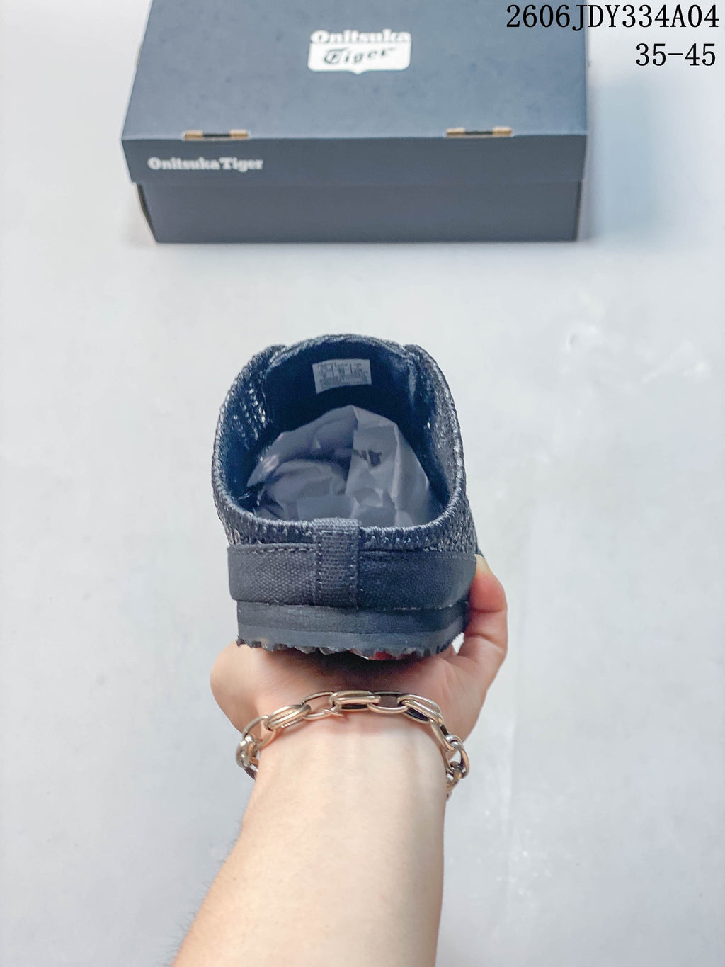 Rear view of a dark navy Onitsuka Tiger Sabot shoe with an open heel.