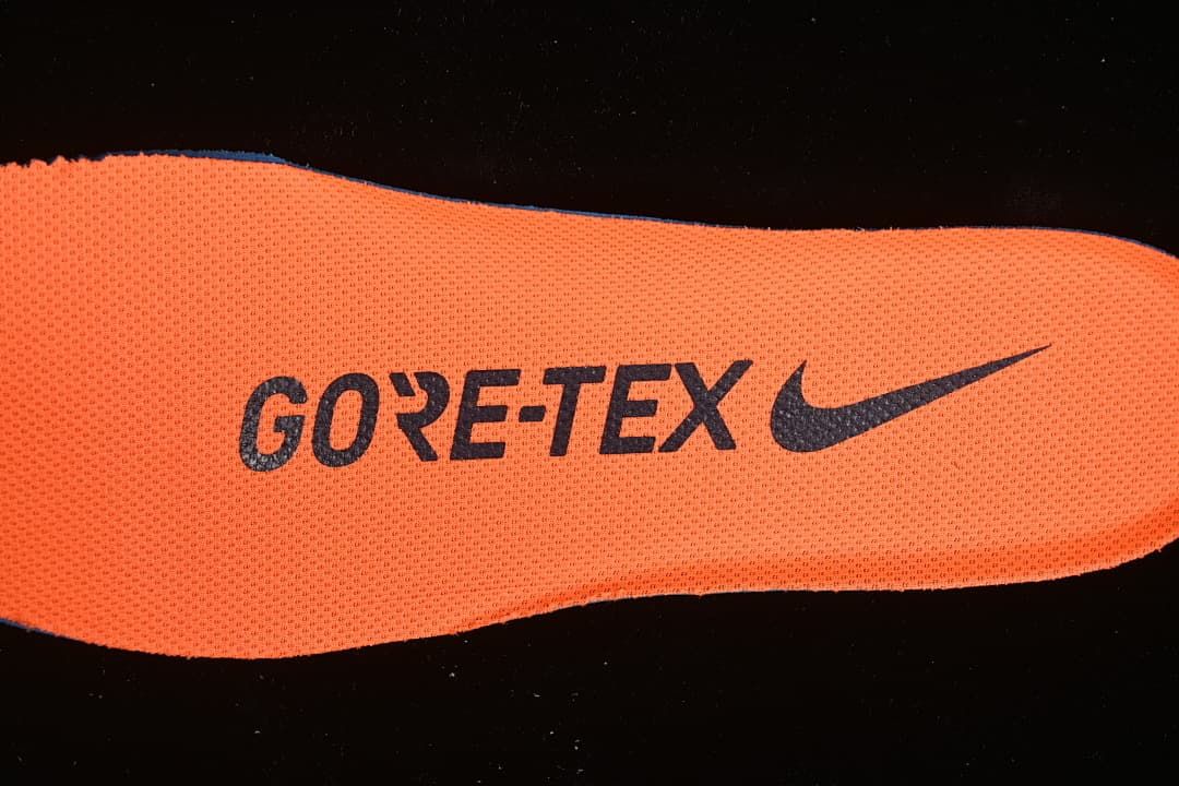 Close-up of an orange insole with GORE-TEX branding