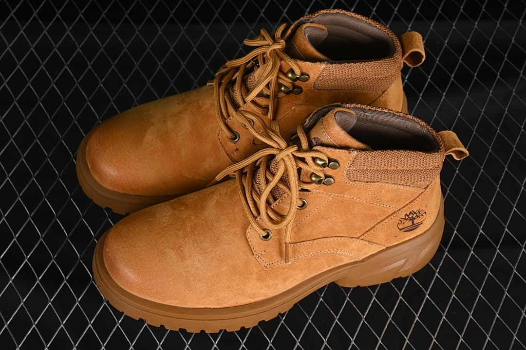Pair of yellow-brown mid-top boots shown from above