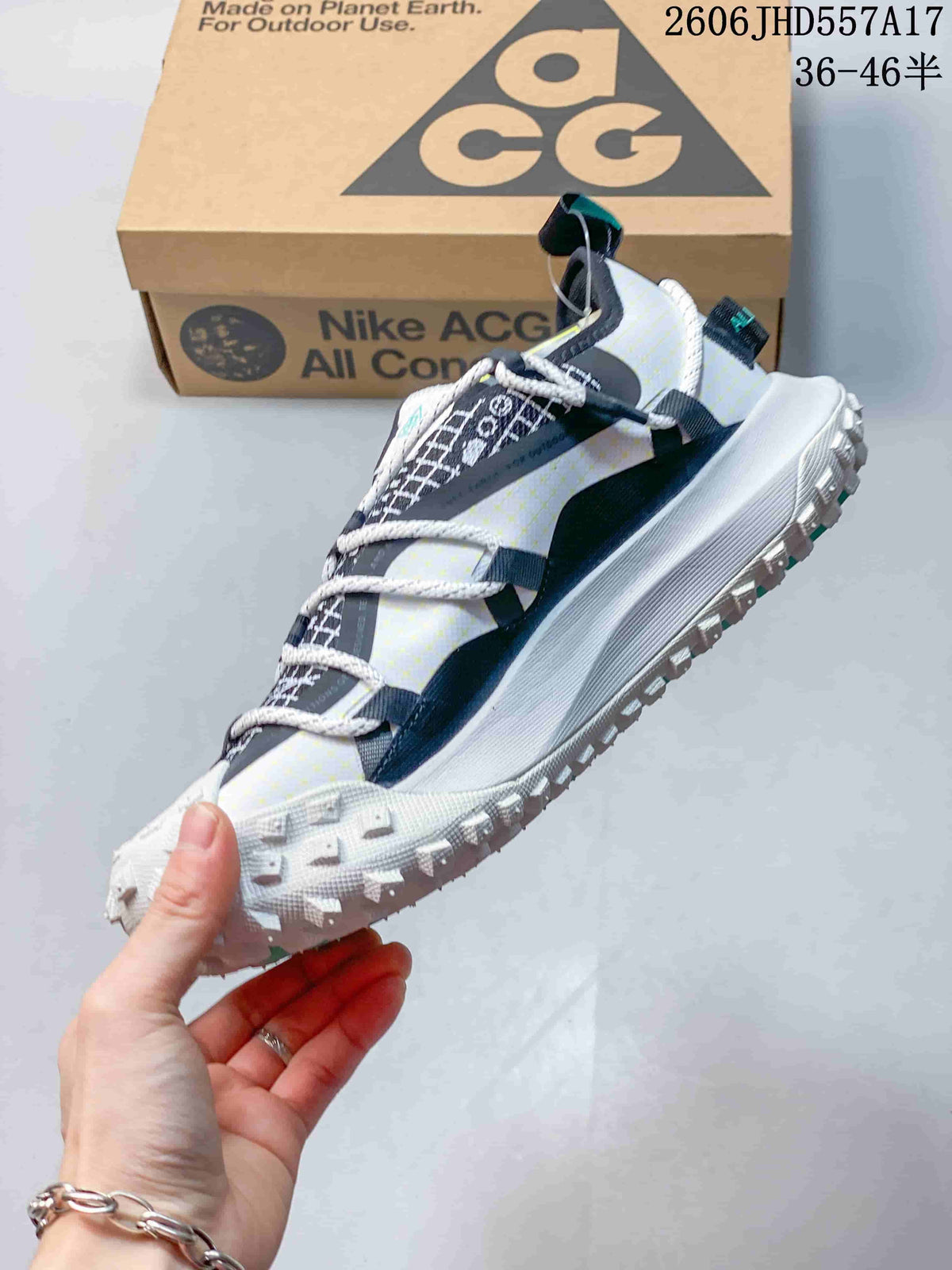 Side view of a Nike ACG Mountain Fly sneaker with patterned upper and rope-style laces