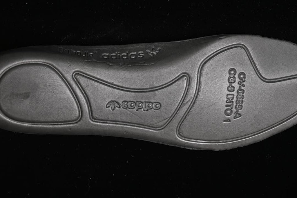 Close-up of the sneaker outsole with embossed branding