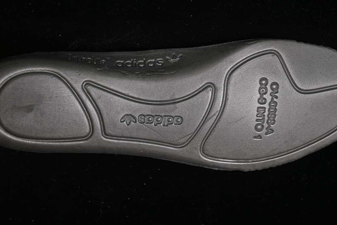 Close-up of the sneaker outsole with embossed branding