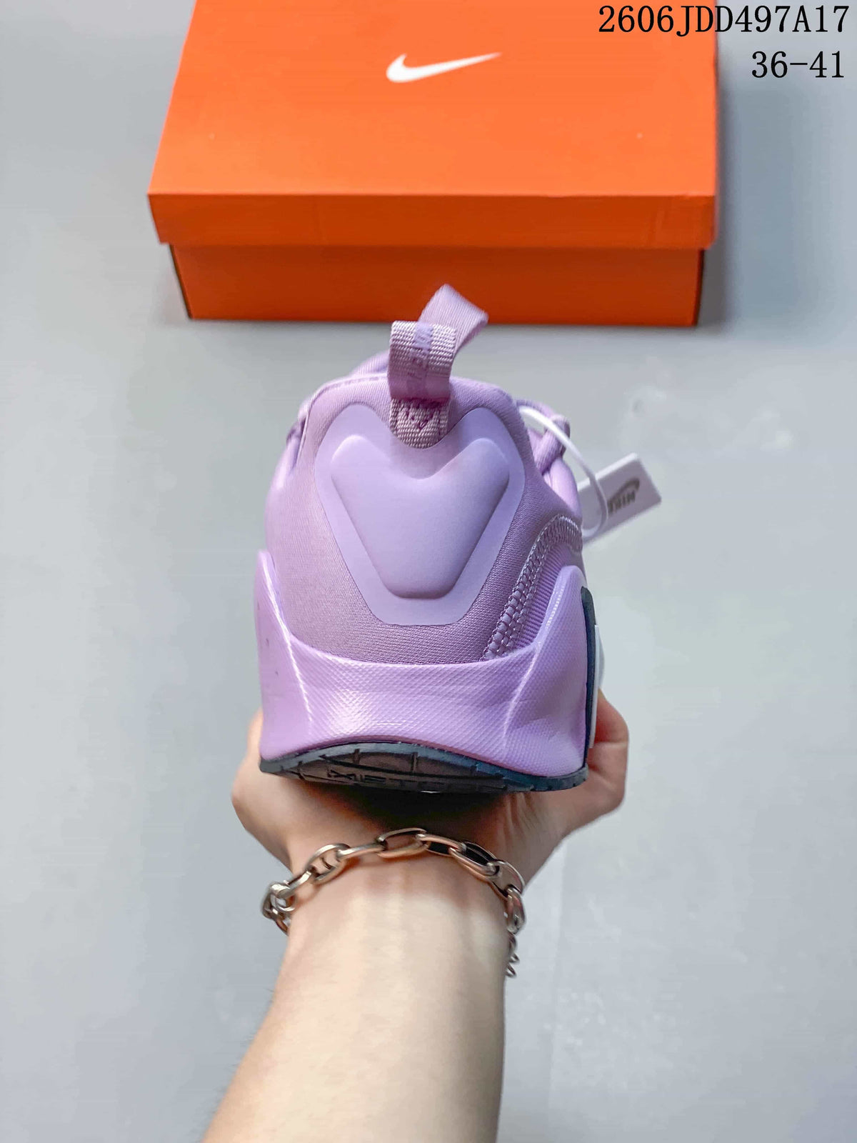 Rear view of a lavender training shoe showing the heel pull tab
