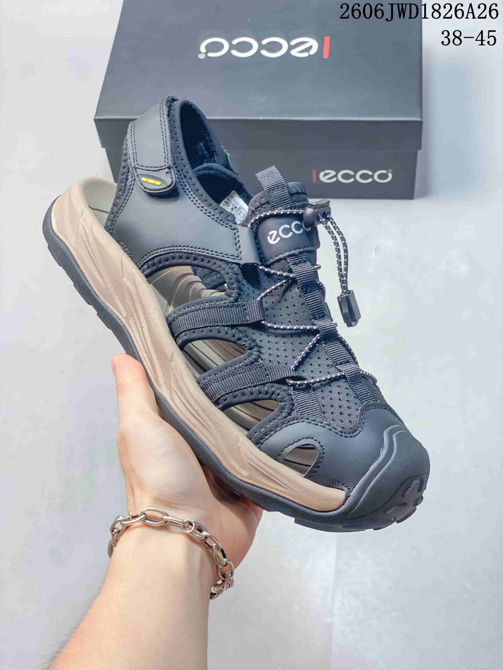 Close-up of a dark gray ECCO open-toe sandal with side cutouts, an adjustable heel strap, and a cord-style front closure.
