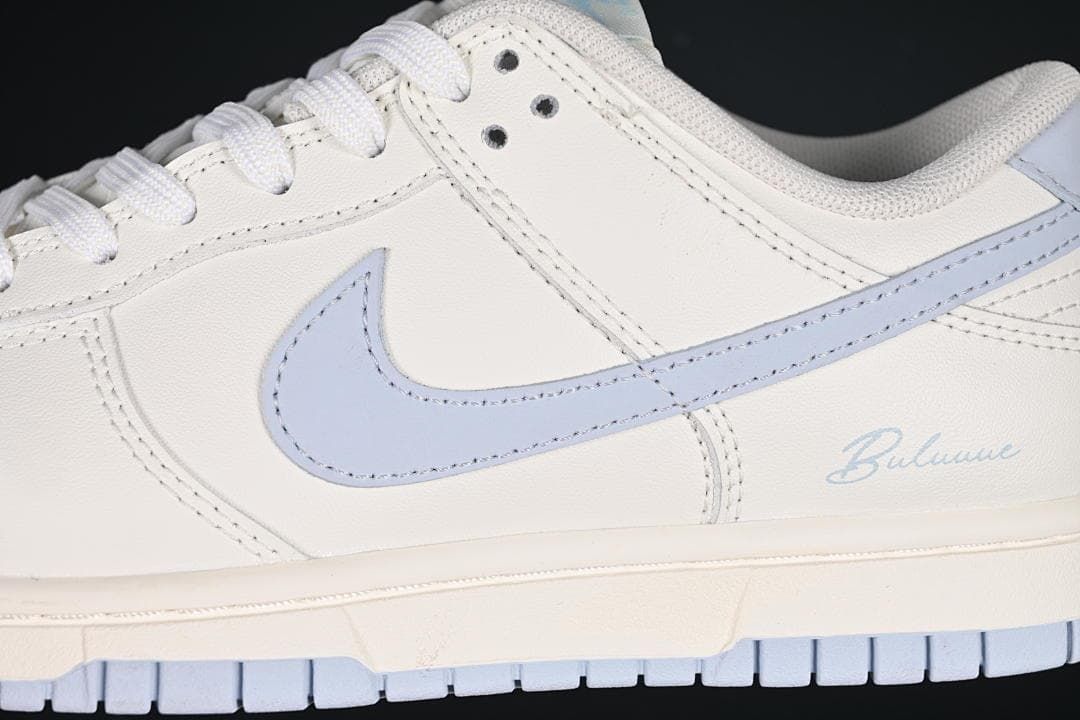 Close-up of the light blue Swoosh and heel script